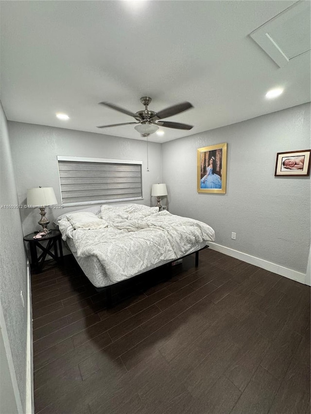 bedroom featuring ceiling fan and dark hardwood / wood-style floors