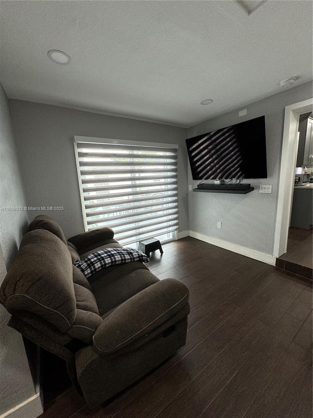 living room featuring a textured ceiling