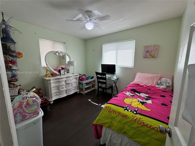 bedroom featuring a ceiling fan and dark wood finished floors