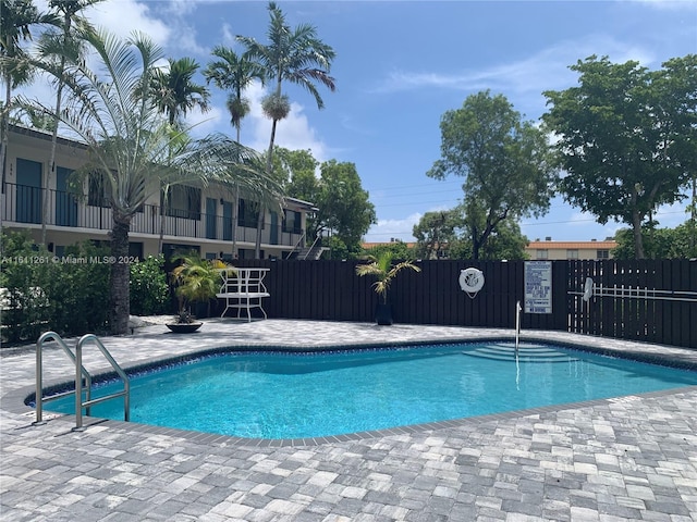 view of pool featuring a patio