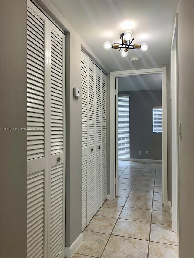 hallway featuring light tile patterned floors