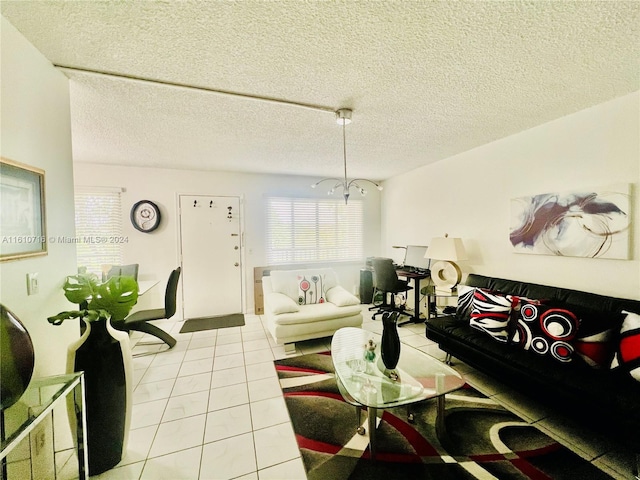 tiled living room featuring a textured ceiling