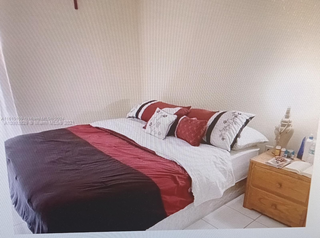 bedroom featuring tile flooring