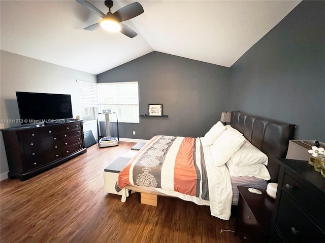 bedroom with baseboards, a ceiling fan, vaulted ceiling, and wood finished floors