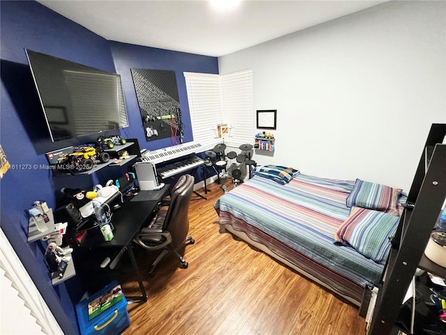 bedroom featuring wood finished floors