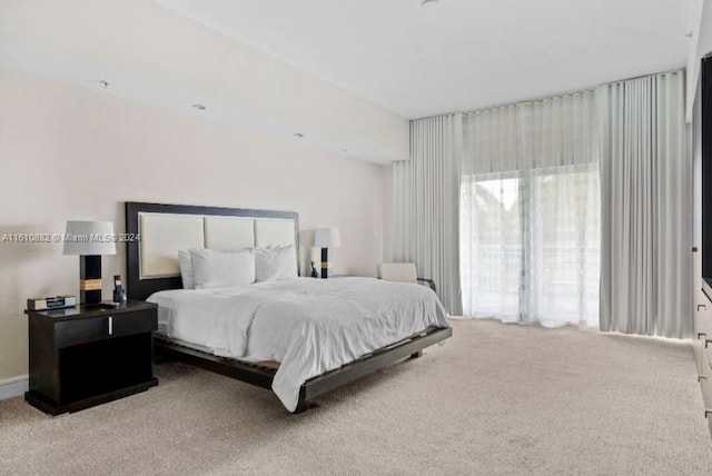 bedroom with light colored carpet