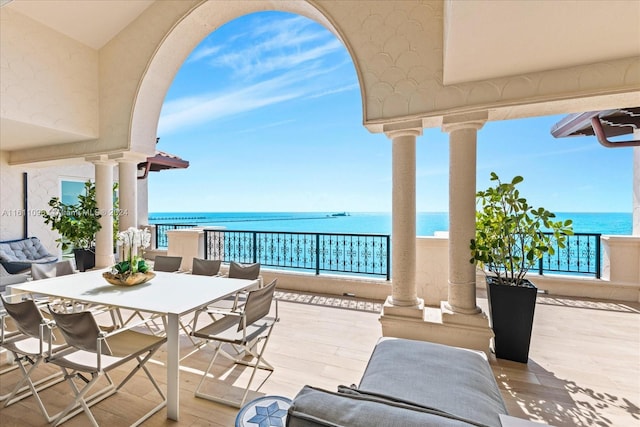 balcony featuring a water view