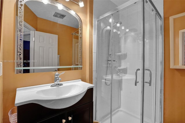 bathroom featuring vanity and walk in shower