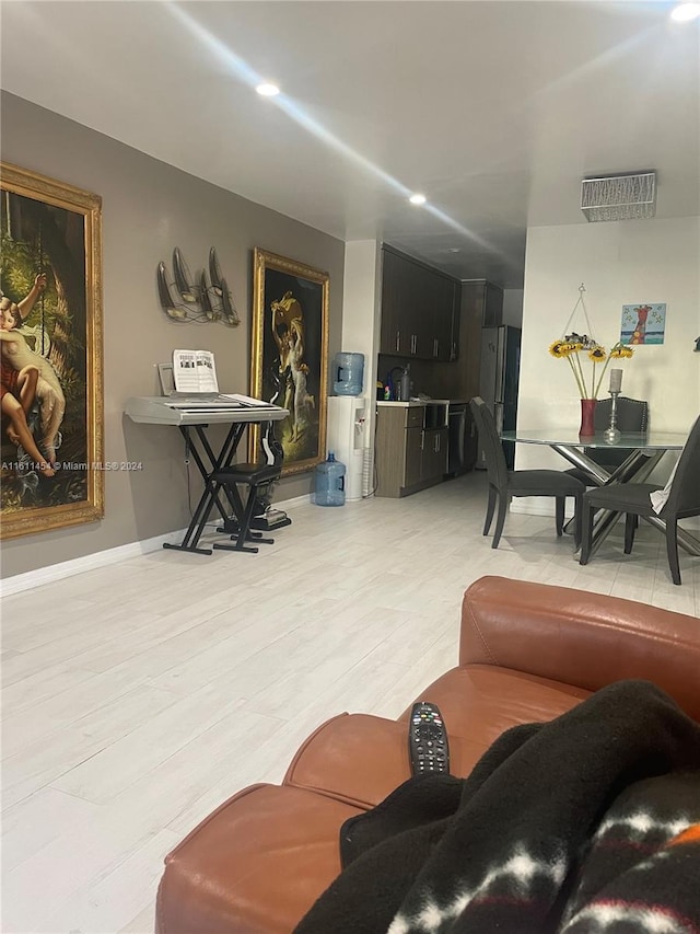 living room with light hardwood / wood-style flooring