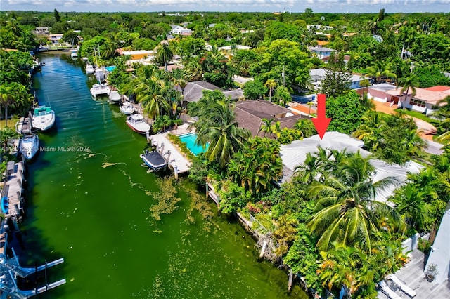 birds eye view of property featuring a water view