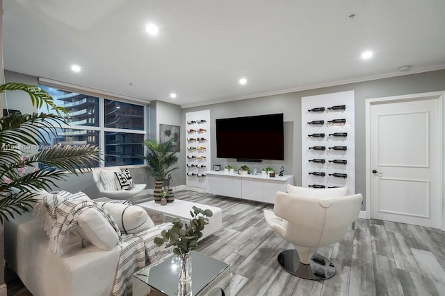 living room with crown molding, wood finished floors, and recessed lighting