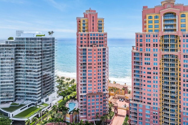 exterior space featuring a water view and a city view