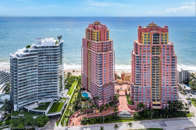 aerial view featuring a view of the beach and a water view