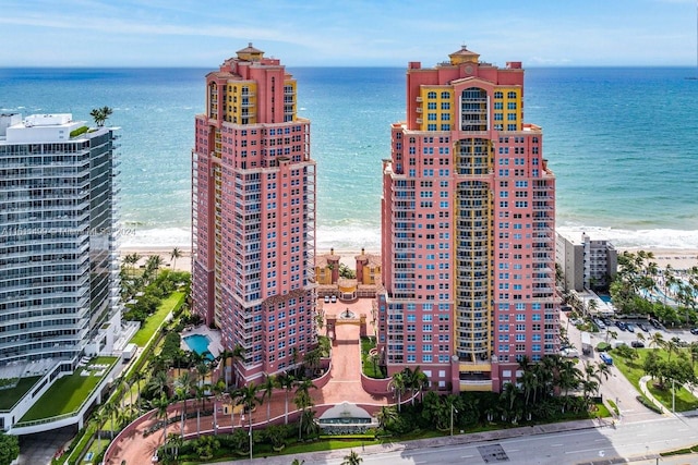 birds eye view of property featuring a view of city and a water view