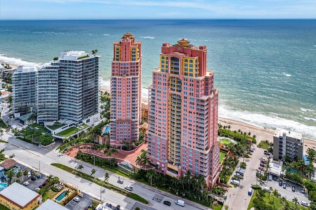 bird's eye view featuring a beach view and a water view