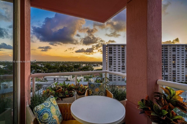 view of balcony at dusk