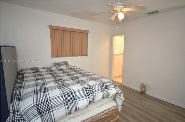 bedroom with wood-type flooring and ceiling fan