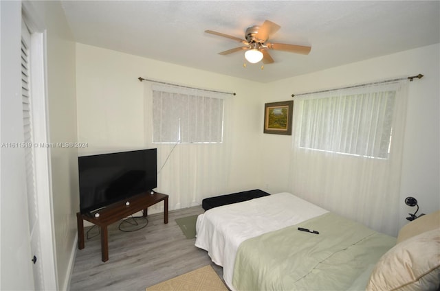 bedroom featuring hardwood / wood-style flooring and ceiling fan