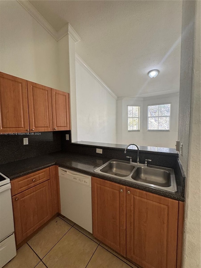 kitchen featuring light tile patterned floors, white appliances, crown molding, and sink