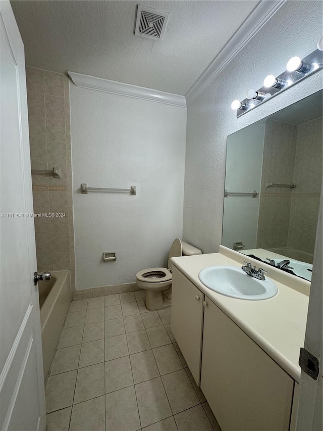 bathroom featuring toilet, tile patterned flooring, a textured ceiling, and ornamental molding