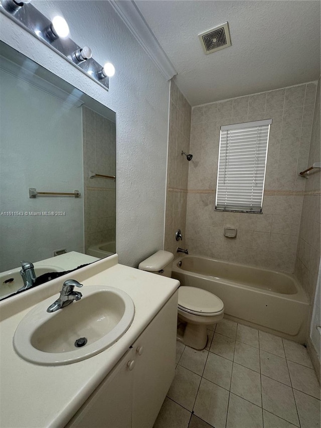 full bathroom with tile patterned flooring, crown molding, a textured ceiling, toilet, and vanity