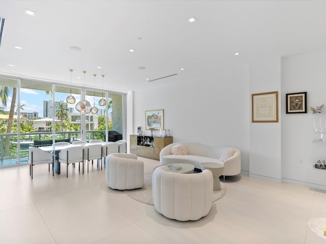 tiled living room with floor to ceiling windows