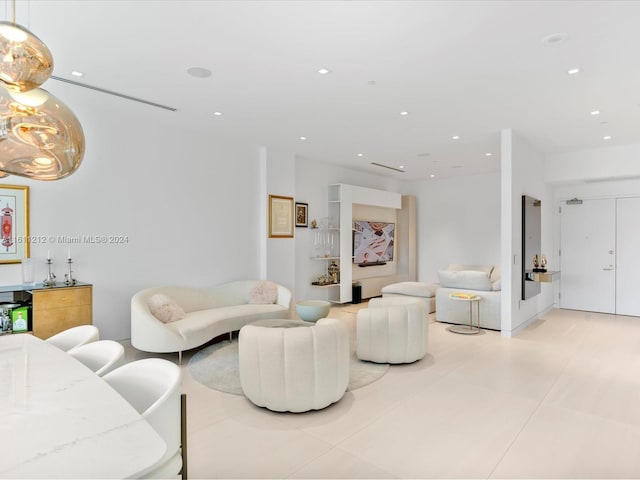 living room featuring light tile flooring