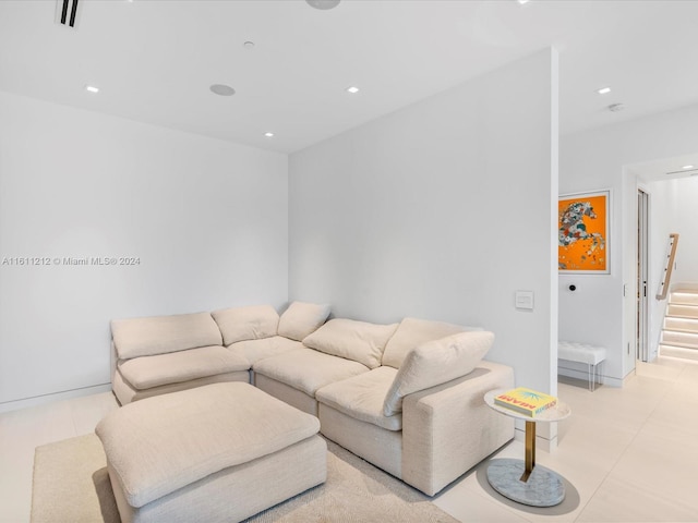 living room featuring light tile flooring