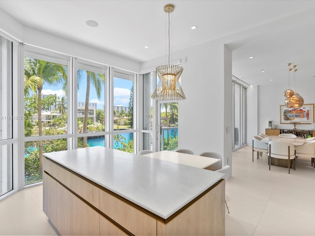 16500 Collins Ave Unit Th-8, Sunny Isles Beach, FL 33160 - kitchen featuring light brown cabinetry, decorative light fixtures, light countertops, and recessed lighting