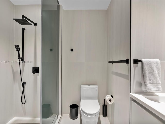 bathroom featuring an enclosed shower and toilet