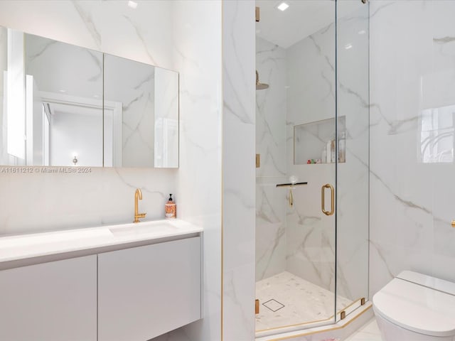 bathroom featuring walk in shower, tile floors, tile walls, vanity, and toilet