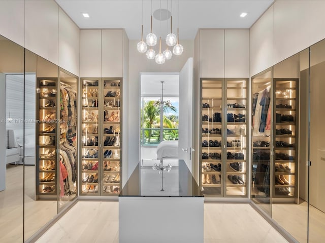 16500 Collins Ave Unit Th-8, Sunny Isles Beach, FL 33160 - walk in closet featuring a chandelier