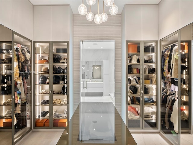 16500 Collins Ave Unit Th-8, Sunny Isles Beach, FL 33160 - walk in closet with a chandelier