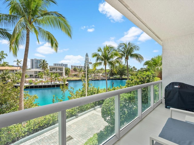 balcony featuring grilling area and a water view