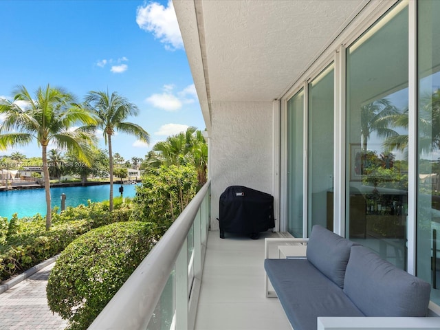 balcony featuring a water view