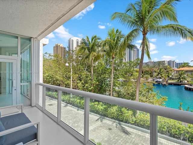 balcony featuring a water view