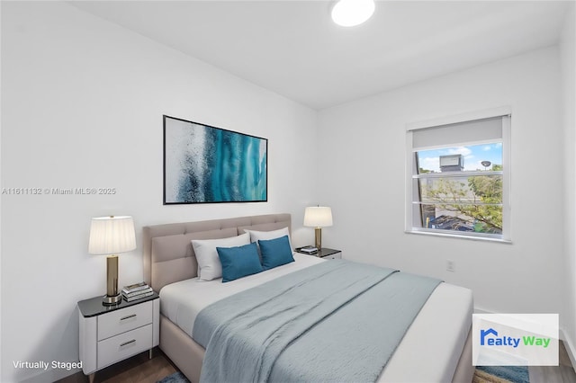 bedroom featuring dark hardwood / wood-style floors