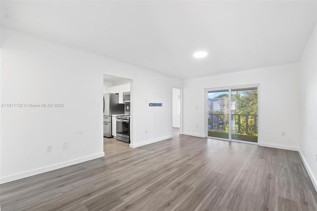 unfurnished living room featuring light hardwood / wood-style floors