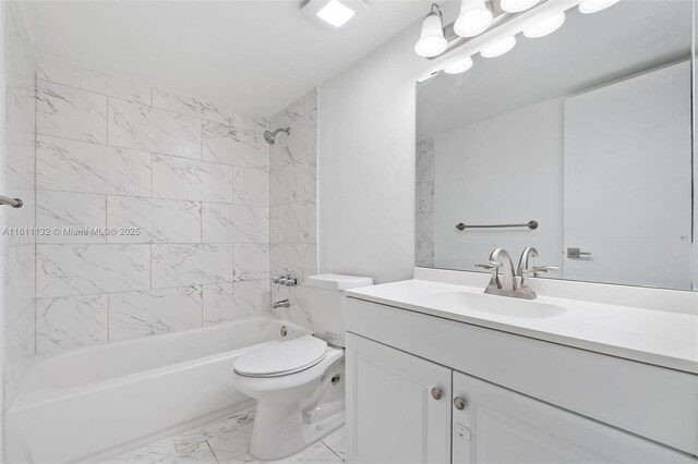 full bathroom featuring toilet, vanity, and tiled shower / bath