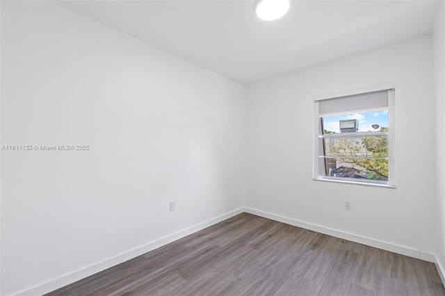 empty room featuring hardwood / wood-style flooring