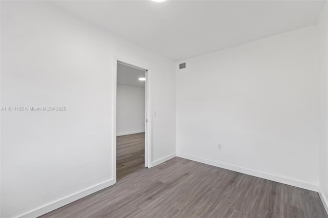 unfurnished room featuring hardwood / wood-style floors