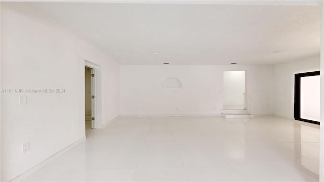 empty room featuring light tile patterned floors