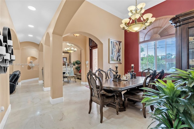 dining room with tile floors, crown molding, and an inviting chandelier