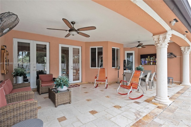 view of terrace with french doors and ceiling fan