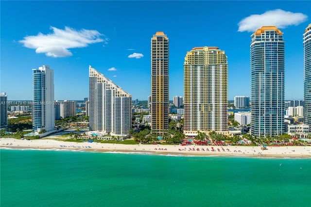 city view featuring a view of the beach and a water view