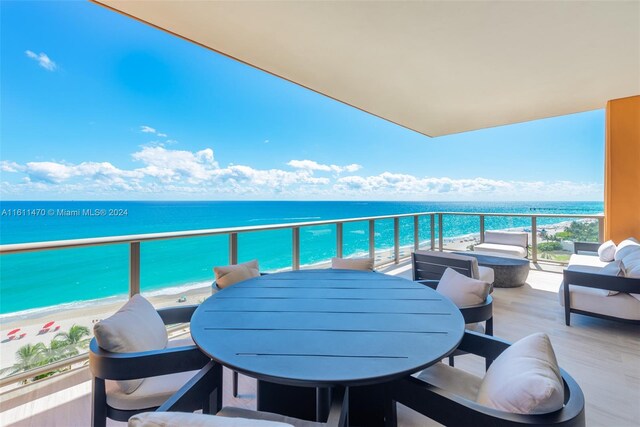 balcony with a beach view and a water view