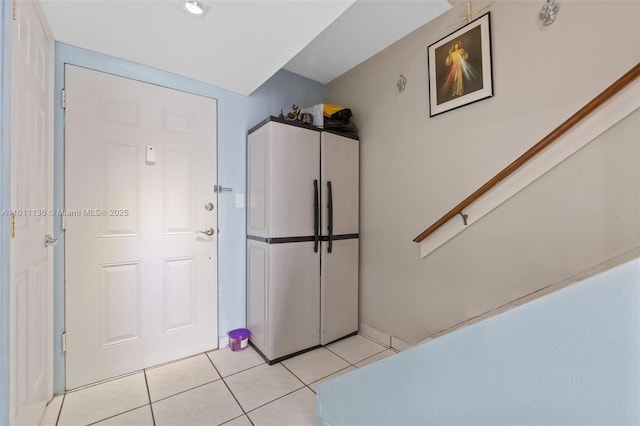 entryway featuring light tile patterned floors