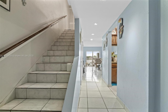 staircase with tile patterned flooring