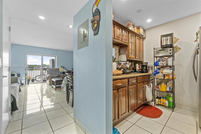 kitchen with light tile patterned flooring