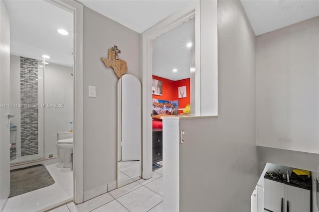 bathroom with tile patterned flooring and toilet